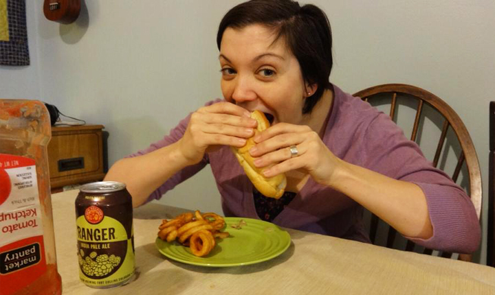 Kate eating a celebratory cheesesteak, washed down with beer, after her breastmilk stopped making Jack poop blood. Does it get more triumphant than this?